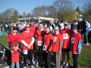Young AFCEANs such as (l-r) Lisa Pandolf and her son Kenny, Tom Leggett, Victor Holinko, Kim Connelly, Jennifer Hammell, Cheryl Davidson, Ron Kushinir and Jennifer Kalogiannis participate in the Lt. Dennis W. Zilinski II, USA, Memorial Run, held in November. 